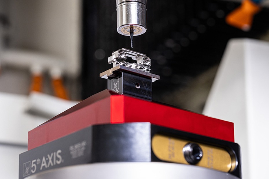 5-axis CNC machining process with end mill cutting titanium aerospace component on a precision fixture, showcasing advanced manufacturing technology used by FK Instrument Co.