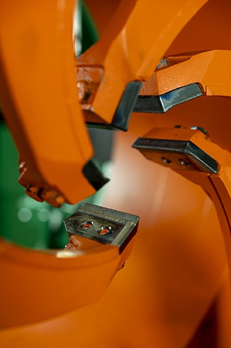 Close-up of rugged knife tips for debarkers, showcasing durable wear surfaces and advanced manufacturing details, relevant to Nicholson Manufacturing's additive manufacturing processes using Mastercam and APlus technologies.