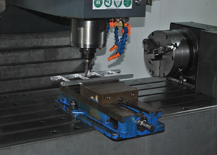 CNC milling machine with Mastercam software, machining SFG winder frame part from 6061-T6 aluminum, showcasing advanced toolpath technology for precision manufacturing.