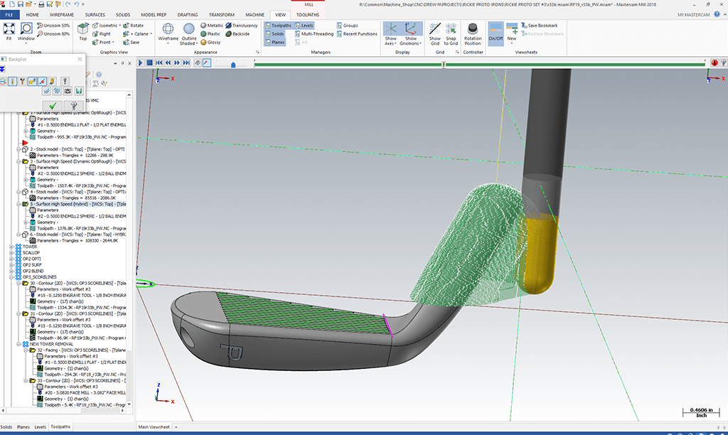 Mastercam simulation screen displaying toolpath for scoreline machining on a COBRA golf club, highlighting CAD/CAM software features and tool verification process.