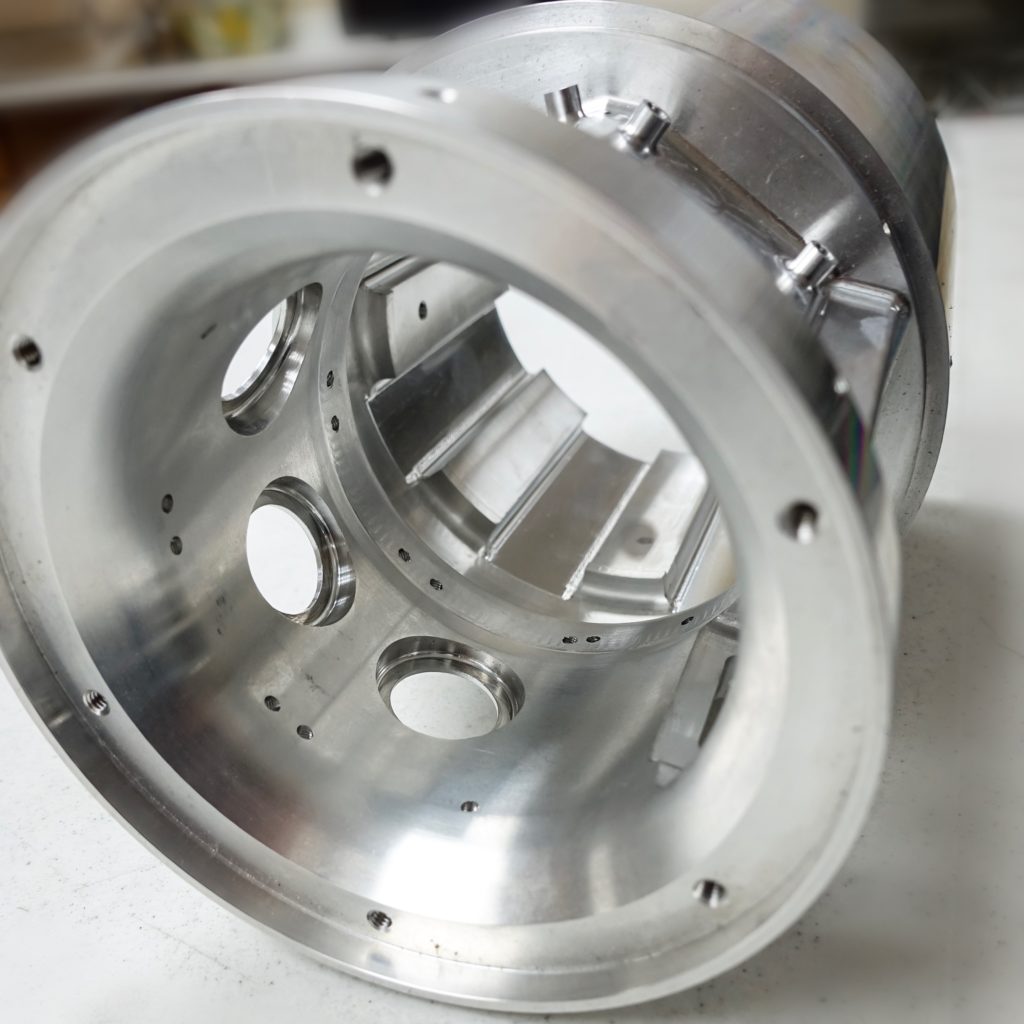 Machined aluminum part showcasing precision engineering for the Mazak Integrex, highlighting intricate details and dual-toolhead design relevant to advanced manufacturing solutions.